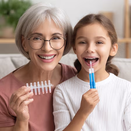 grandmother taking dna test with granddaughter